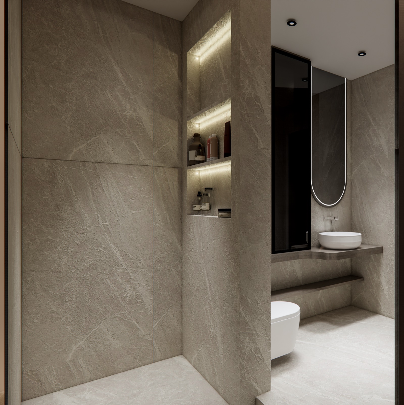 Design render of a shower area clad floor to ceiling in large, softly textured stone-look slabs with very few joints, a tall recessed niche with three lit shelves holding bottles, and beyond a partition a dry zone with a wall-hung WC, a timber counter with a bowl basin and a tall pill-shaped backlit mirror