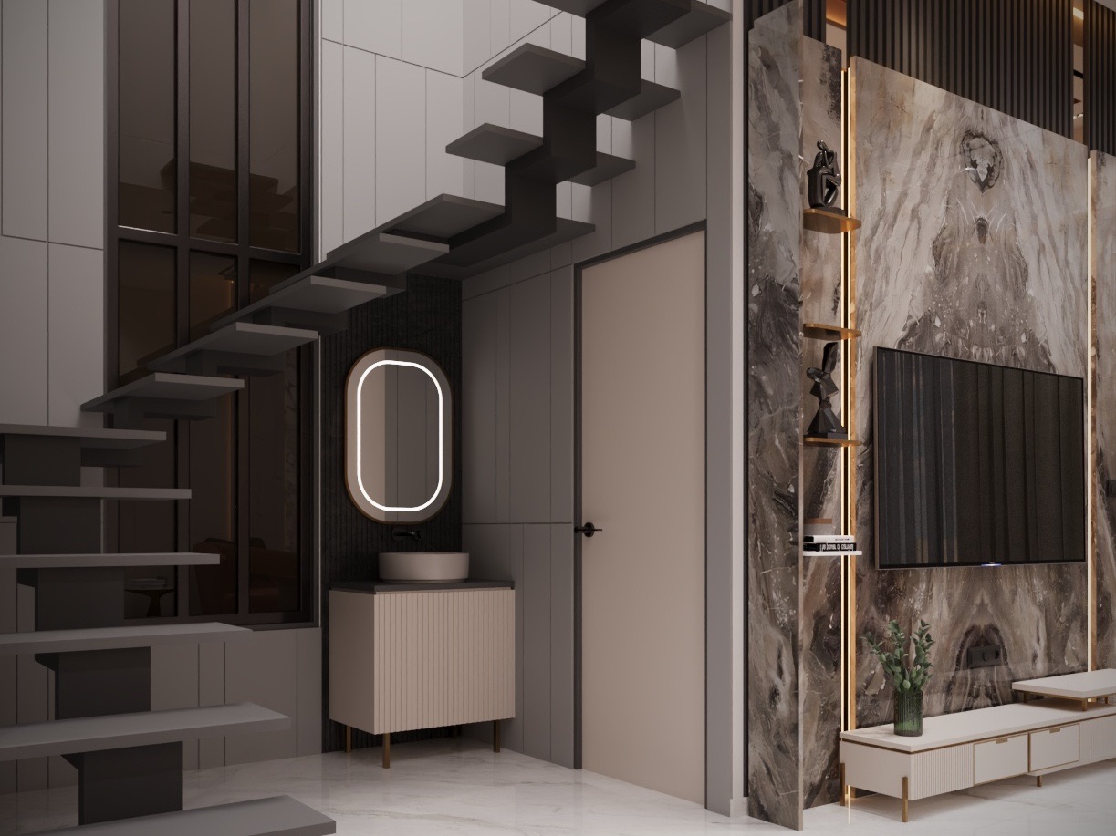 Design render of a double-height stairwell with black cantilevered steps rising past grey panelled walls, a powder vanity with a fluted cabinet and a lit pill-shaped mirror tucked beneath the stair, and a bookmatched marble TV wall with brass shelves on the right