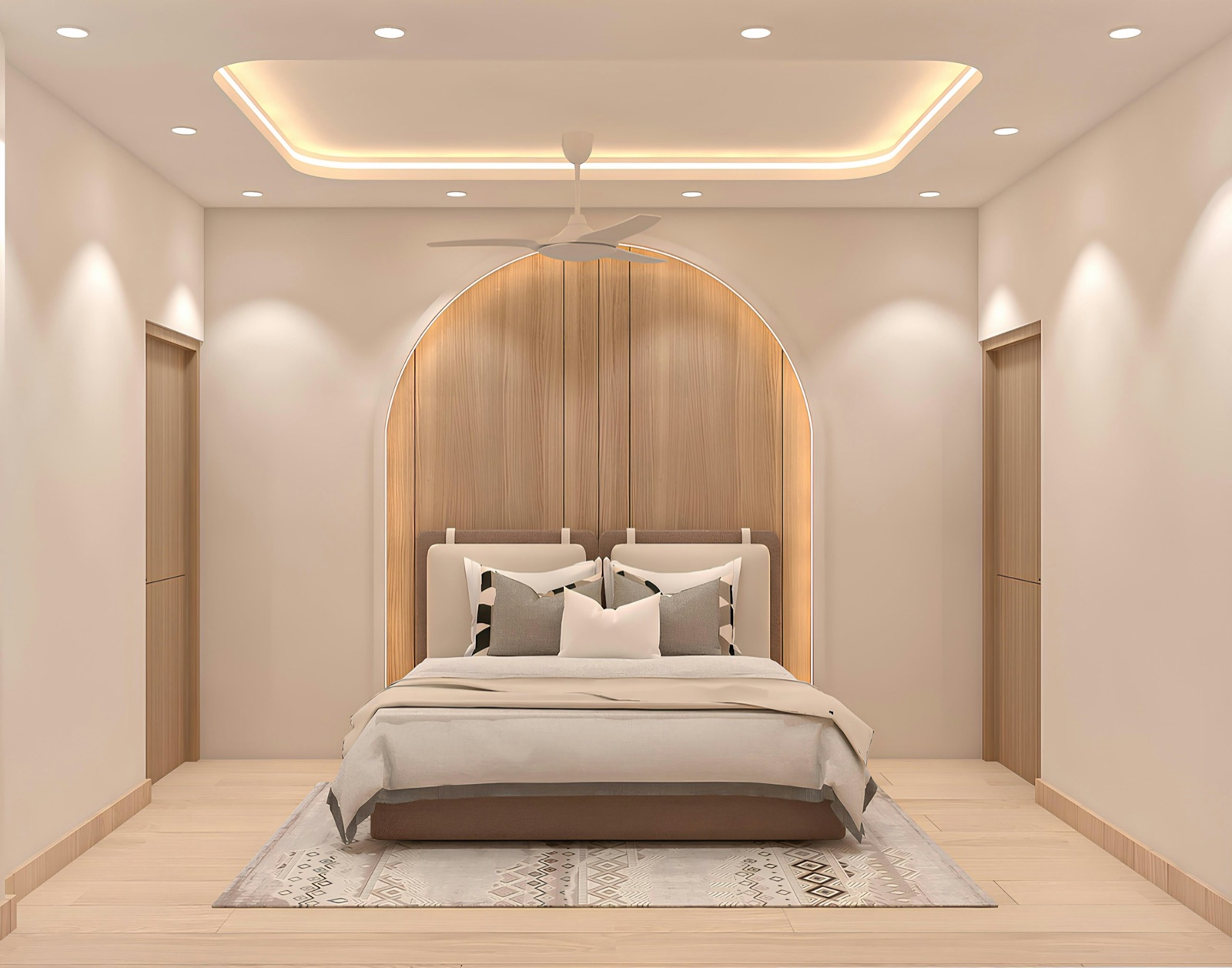 Design render of a bedroom seen from the foot of the bed: a raised rounded-rectangle tray in the ceiling edged with a warm LED cove, a white three-blade fan hanging inside the tray, downlights in the lower ceiling around it washing the walls, and an arched wood-panelled bed wall with a backlit edge behind a queen bed.