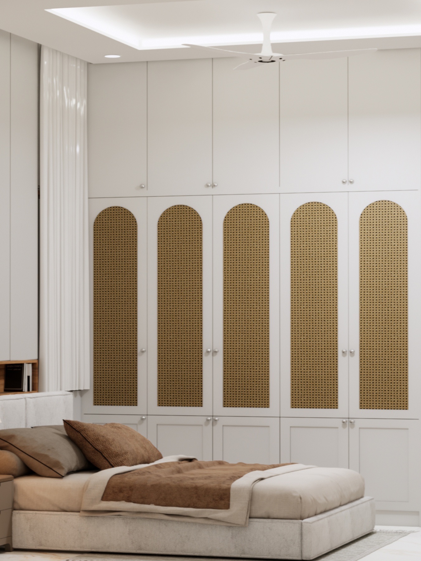 Design render of a bedroom with a floor-to-ceiling white wardrobe, arched cane panels on the doors and loft cabinets above