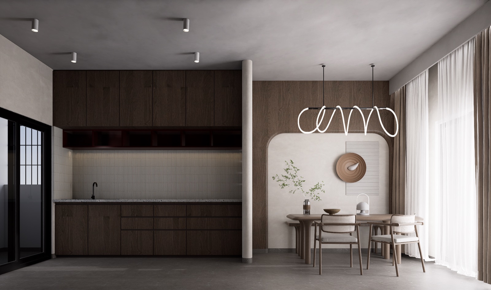 Design render of a straight kitchen along one wall of a Bengaluru apartment: dark wood-finish base and wall units with long handle-less drawers, an open shelf niche under the wall units, a light terrazzo-look counter with a black tap, and a slim tiled backsplash, beside a dining area with an arched alcove and a looped linear pendant light.