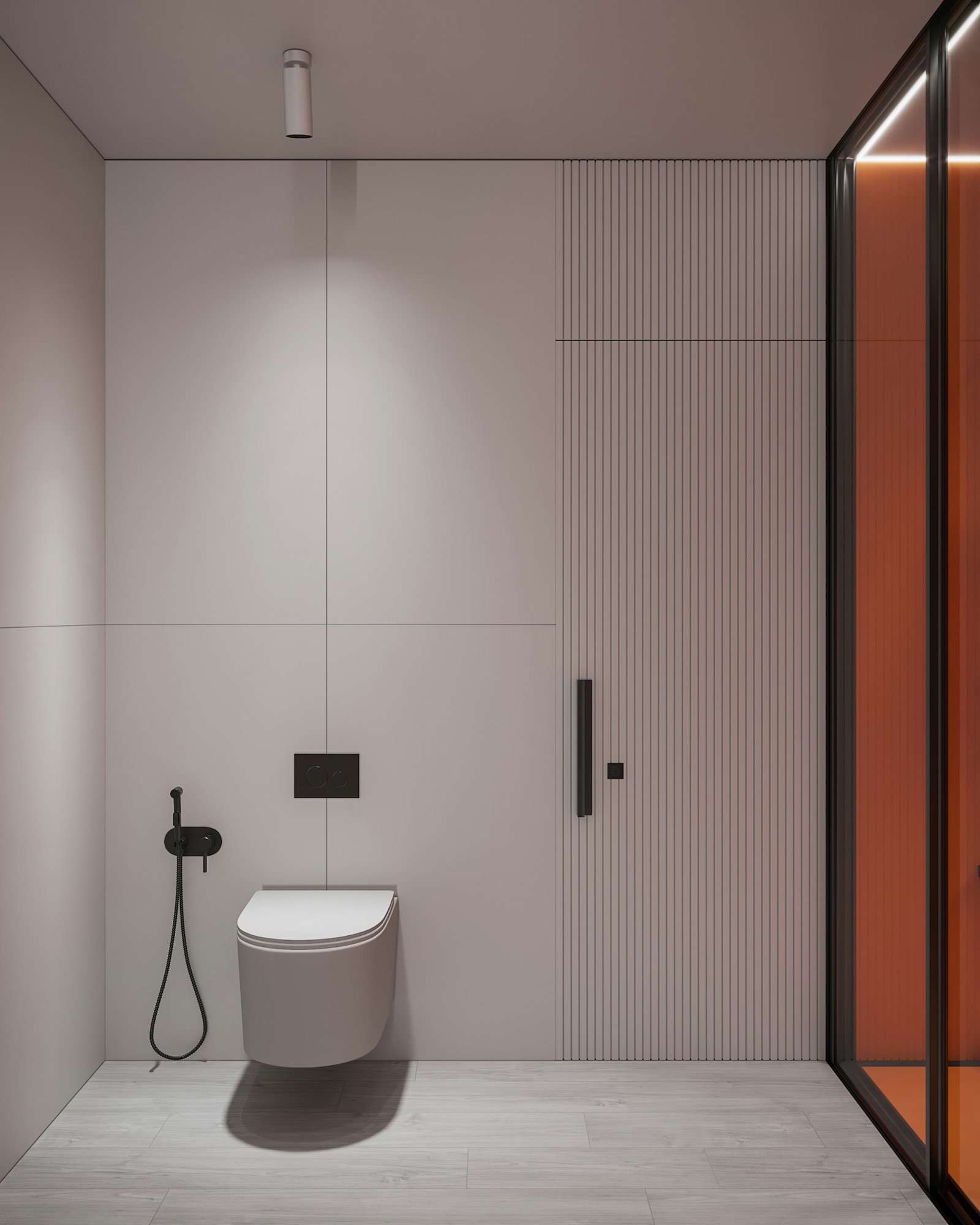 Design render of a minimal bathroom wall: four very large pale pink-grey tiles meet at joints centred on a wall-hung WC and its black flush plate, a fluted panel with a black handle sits to the right, a black health faucet to the left, and a light wood-look plank tile floor