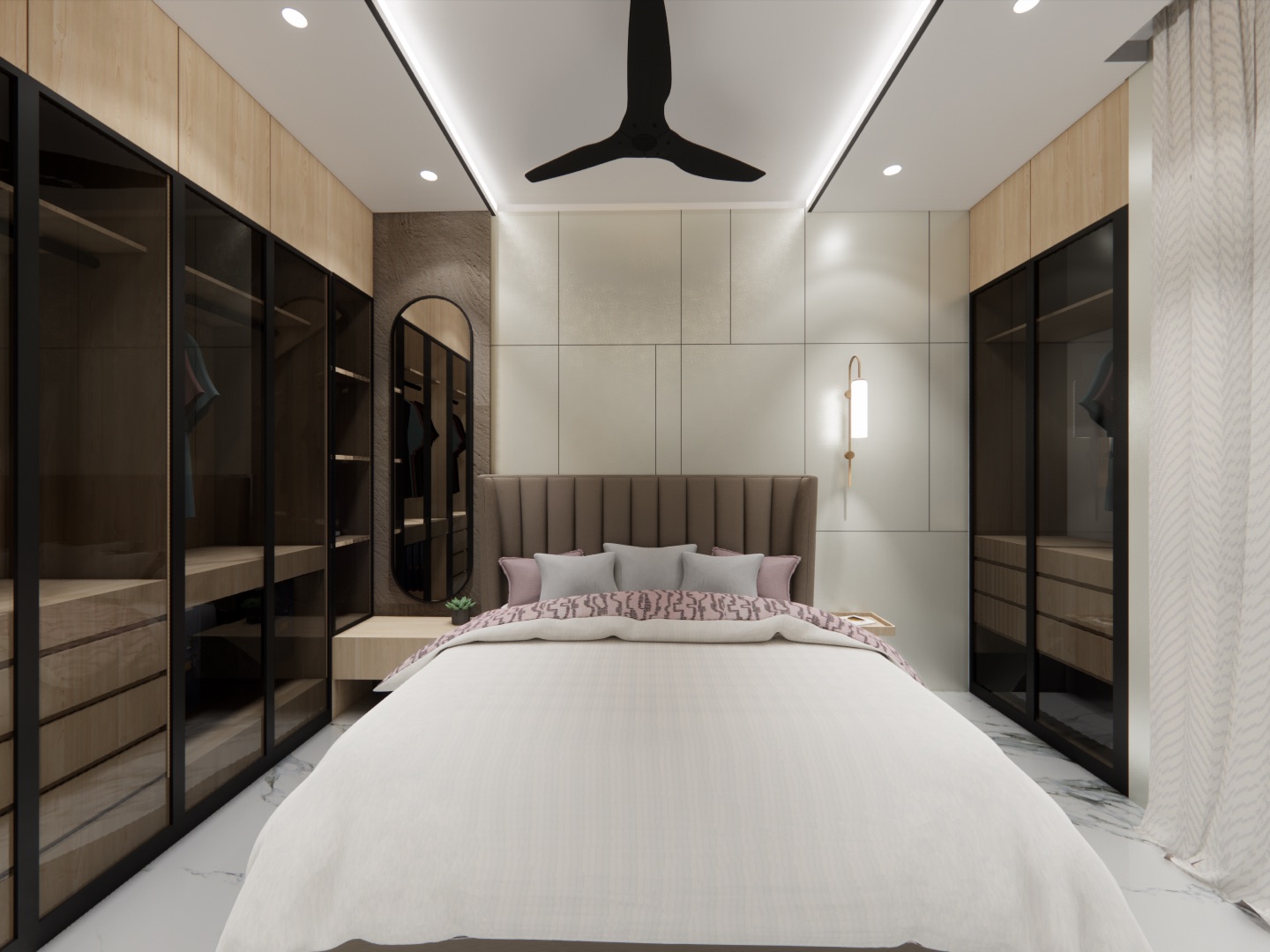 Design render of a narrow bedroom: floor-to-ceiling wardrobes with black-framed tinted glass shutters line the left wall and the far right corner, with wood-finish loft panels above them, an oval mirror on a textured panel beside the bed, a fluted brown headboard and a cove-lit ceiling with a black fan.
