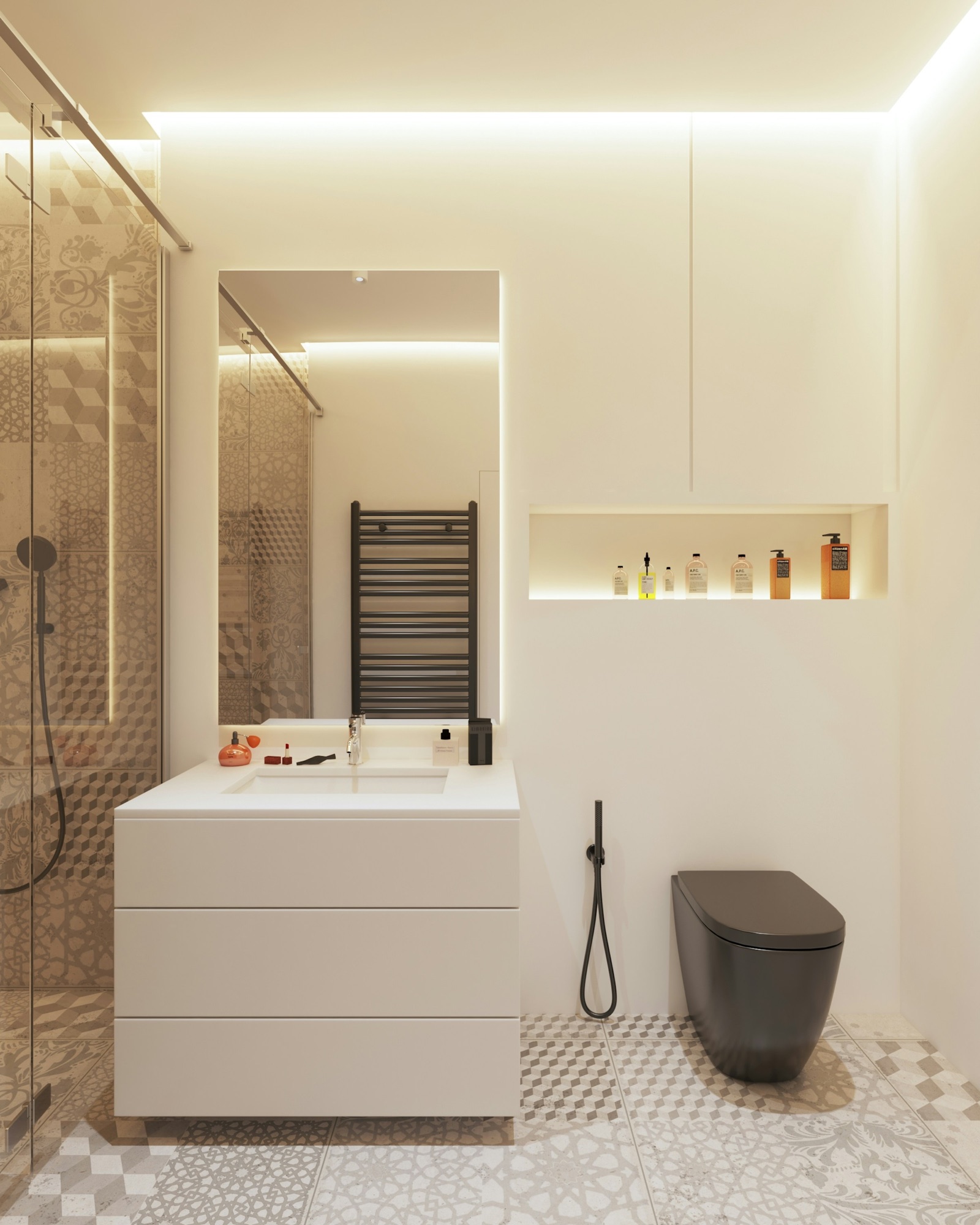 Design render of a compact bathroom: grey and white patterned cement-look tiles cover the floor and the shower wall behind a sliding glass door, the other walls are plain white with a lit niche, a white drawer vanity, a dark wall-hung WC and a black health faucet